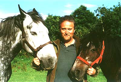 a horse-logger with his heavy horses